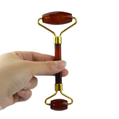Disponibile il logo personalizzato del prodotto di bellezza facciale Carnelian Guasha Face Roller per massaggiatore di agata rosso cristallino naturale al 100%
