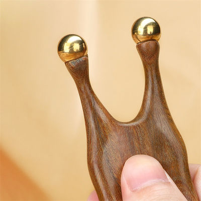 Strumento di massaggio Gua Sha di legno di sandalo di rame puro per la stimolazione del viso e degli occhi