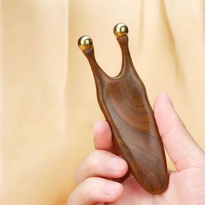 Strumento di massaggio Gua Sha di legno di sandalo di rame puro per la stimolazione del viso e degli occhi