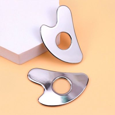 Acciaio inossidabile a forma di cuore Hollow Gua Sha Board Metal Facial Beauty Tool per l'area di massaggio del corpo intero e OEM / ODM