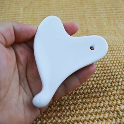 Tabella di ceramica Gua Sha per il rilassamento muscolare su tutto il corpo