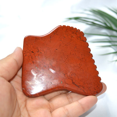 Proprietà del massaggiatore Giappone rosso naturale Gua Sha strumento per il massaggio facciale