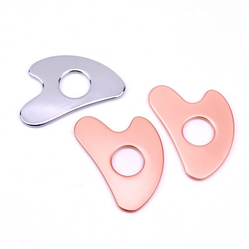 Acciaio inossidabile a forma di cuore Hollow Gua Sha Board Metal Facial Beauty Tool per l'area di massaggio del corpo intero e OEM / ODM