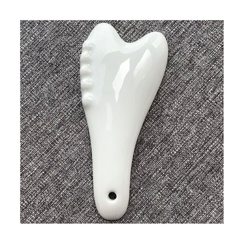 Strumento di massaggio Gua Sha in ceramica bianca per l'acupressione Massaggio facciale e corporeo